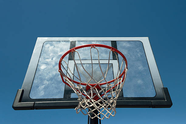 istock Basketball hoop outdoors on a background of blue sky 612396854