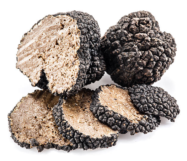 istock Black truffles isolated on a white background. 612396882