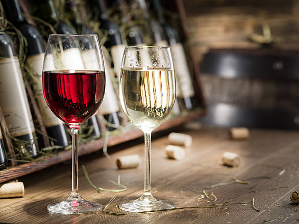 istock Wine bottles on the wooden shelf. 612397080