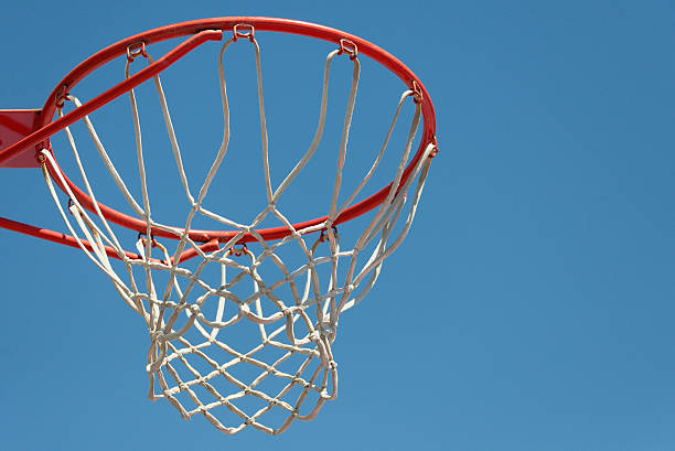 istock Basketball hoop with blue sky background 612397808