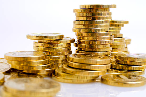 istock Coins from yellow metal. 612398086