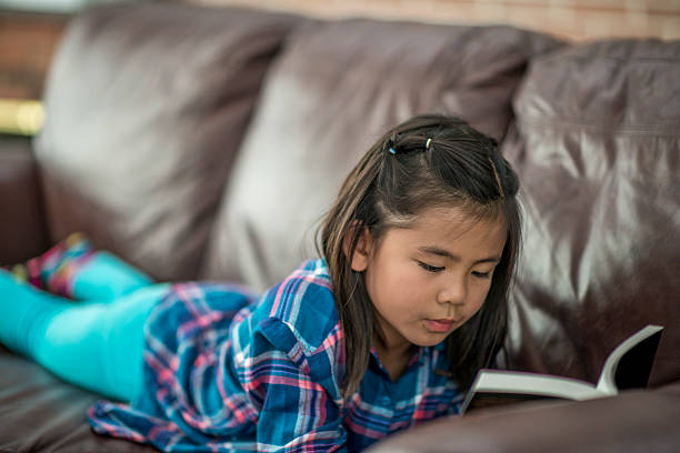 istock Reading a Book for Homeschool 612398412