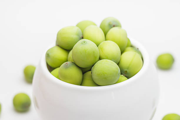 istock Fresh lotus seeds in vase and white background. 612398848