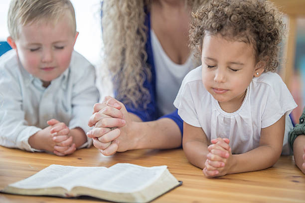 istock Praying Together in Sunday School 612399144