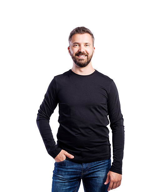 Hipster man in black long-sleeved t-shirt, studio shot, isolated