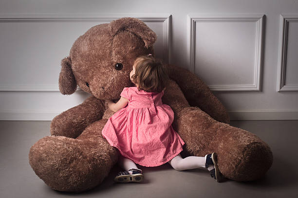 Little Girl Hugging A Big Teddy Bear Stock Photo - Download Image Now -  Large, Teddy Bear, Girls - iStock