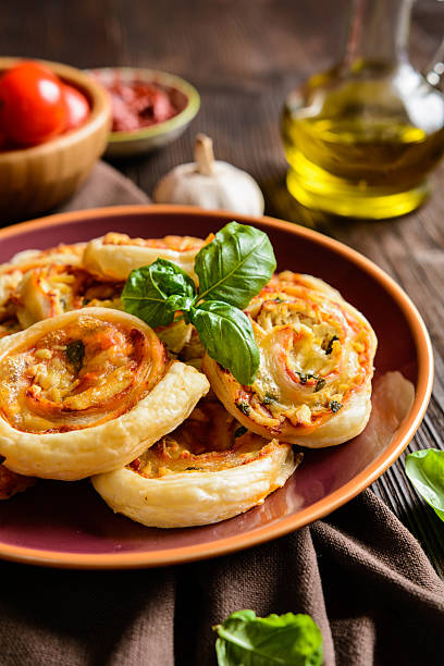 istock Puff pastry rolls stuffed with tofu, mozzarella and tomato sauce 612400300