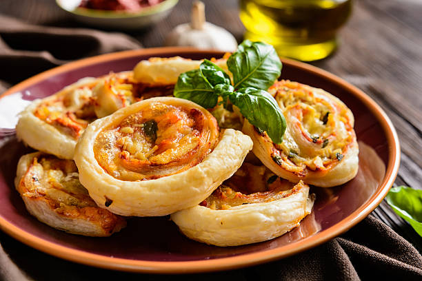 istock Puff pastry rolls stuffed with tofu, mozzarella and tomato sauce 612400384