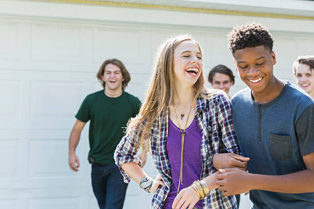 istock Multi-ethnic teenage friends laughing 612400390