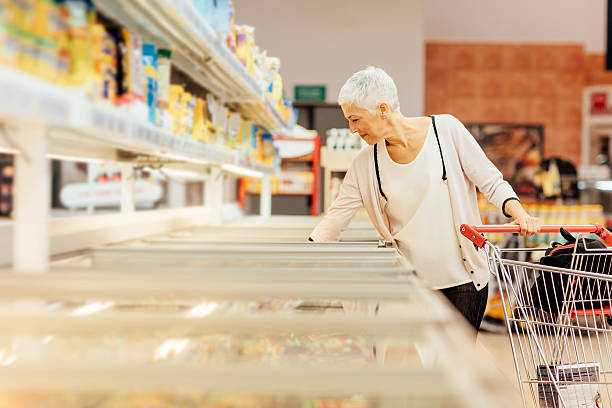 istock Mature Woman Groceries Shopping. 612401310
