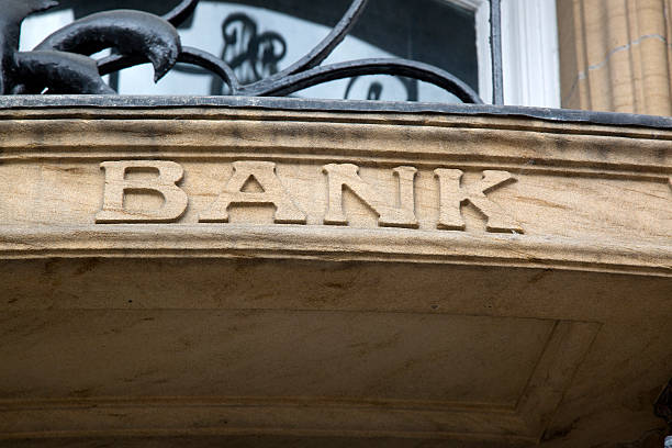 istock Bank Sign on Stone Building Facade 612402316