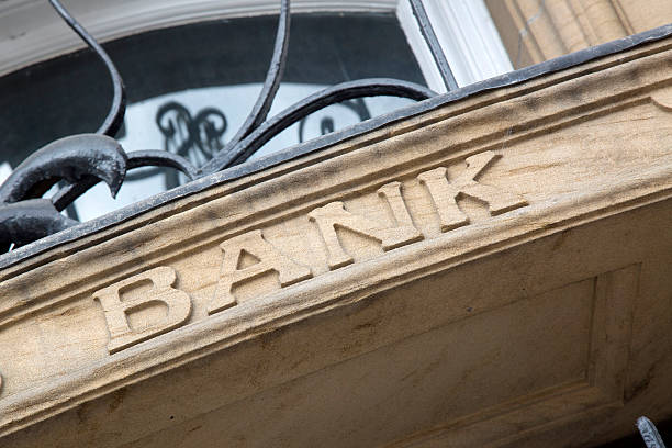 istock Bank Sign on Stone Building Facade 612402418