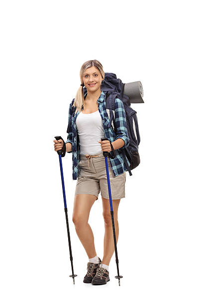istock Female hiker posing with hiking equipment 612407404