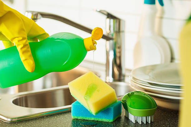 istock pouring dishwashing liquid on sponge kitchen wash cleaning 612407884