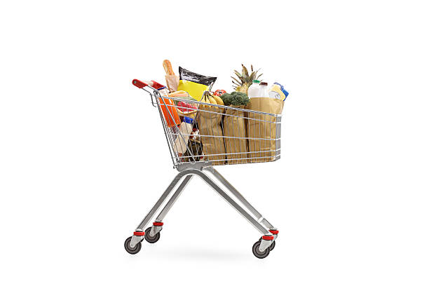 istock Shopping cart filled with groceries 612408066