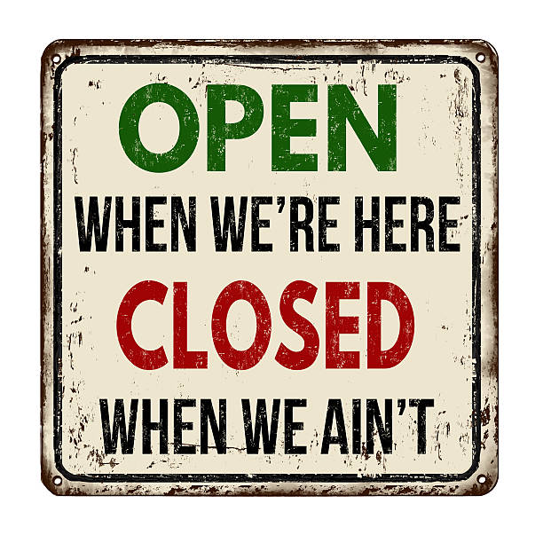 istock Open when we're here closed when we ain't vintage  metal sign 612408698