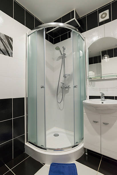 Interior showers with toilets are in black and white stock photo