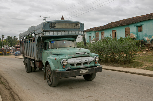 trinidad, Сuba - January 21, 2016: People are travelling at streets with old trucks in trinidad of Cuba