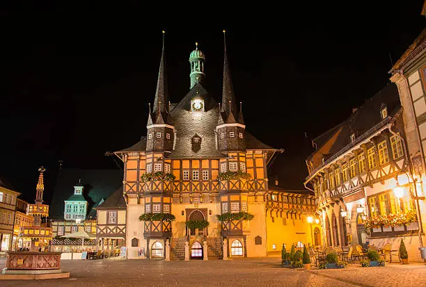 illuminated town hall in the centre of wernigerode by night, it is half timbered building style