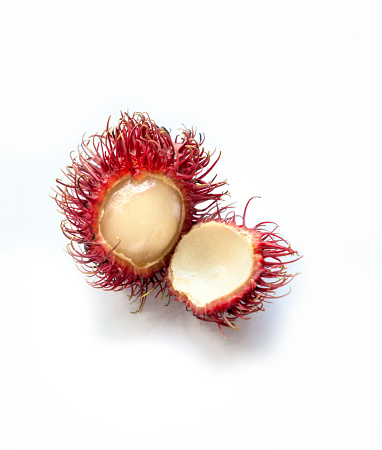 peeled Tropical fruit rambutan on white background