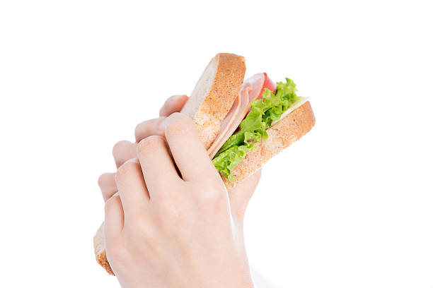 istock Person holding a BLT sandwich 612414538