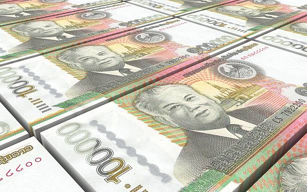 istock Laotian kip bills stacks background. 612415620