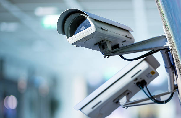 CCTV security camera with blurred background closeup image of CCTV security camera with blurred background big brother orwellian concept photos stock pictures, royalty-free photos & images