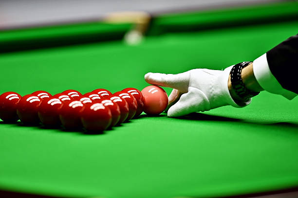 Snooker referee arranging pink ball stock photo