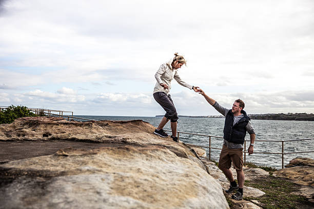 istock Couple walking on the cliffs around Bondi Beach - Sydney 612419862