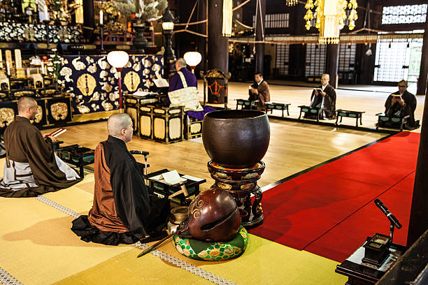 istock Buddhist monks praying in early morning inside a Temple 612421020