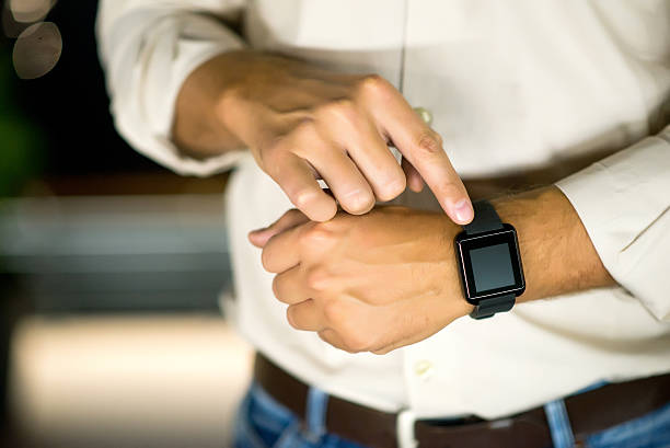 istock Finger Touching Smart Watch, Businessman Setting the time 612478776