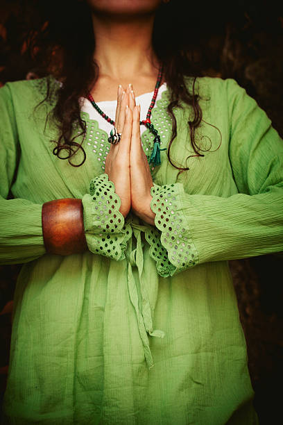 istock woman hands in namaste gesture 612478892