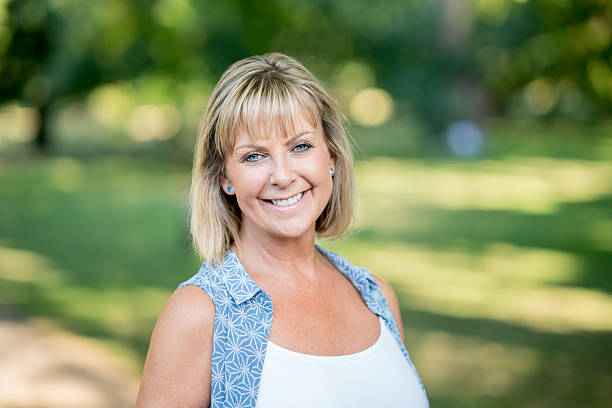 istock Happy woman at the park 612478988