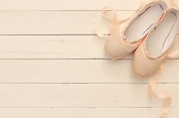 istock silk pointe shoes on white wooden background 612481072