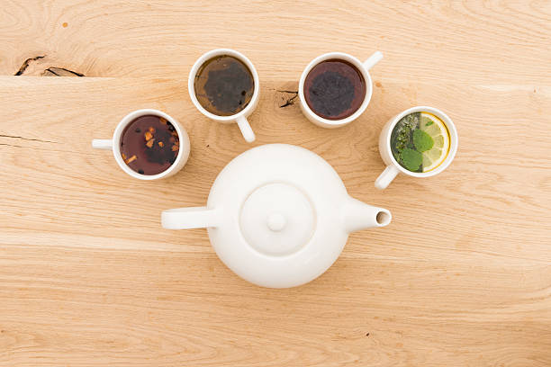 istock cups and teapot on a wooden board 612481294