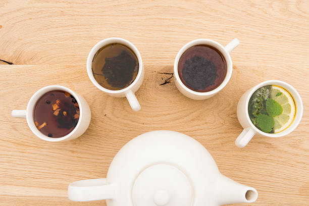 istock cups and teapot on a wooden board 612481530