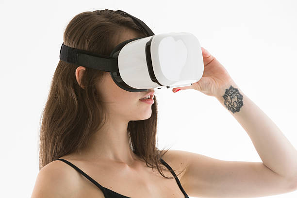 istock Young woman with virtual reality headset 612482288