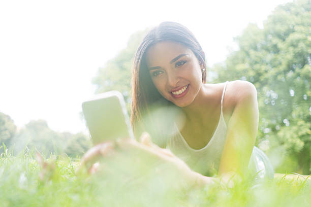 istock Beautiful woman texting on her cell phone 612482310