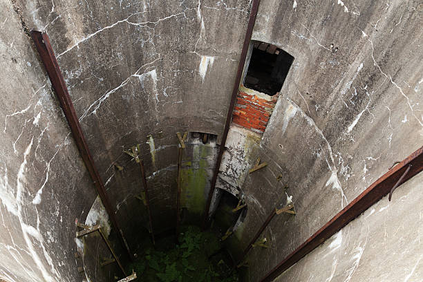 istock Abandoned military silo. Grunge concrete tunnel 612483300