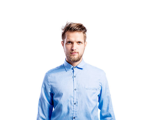 istock Hipster man in blue long-sleeved shirt, studio shot, isolated 612485378
