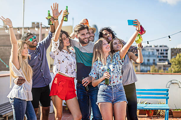 istock Selfie in a rooftop party 612486274