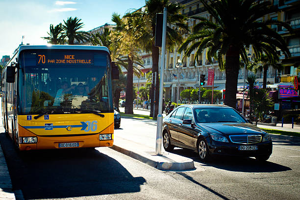 Nice France traffic Nice, France - July 29, 2015: The Promenade Anglais on the Mediterranean sea in Nice, France with traffic during rush hour on a bright sunny day waiting at a traffic light.   This is near the scene of the tragic ISIL attack of 15 Jul 16. islamic state stock pictures, royalty-free photos & images