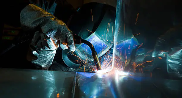 Photo of Industrial steel welder in factory