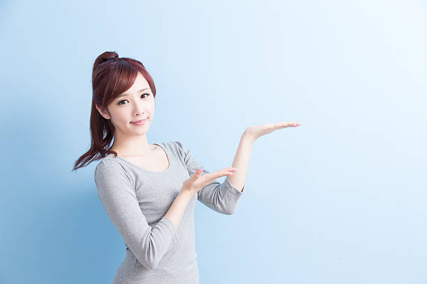 istock beauty girl student show something 612491286