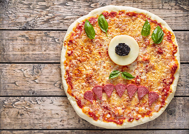 istock Halloween creative scary food eye cyclops monster zombie face pizza 612491832