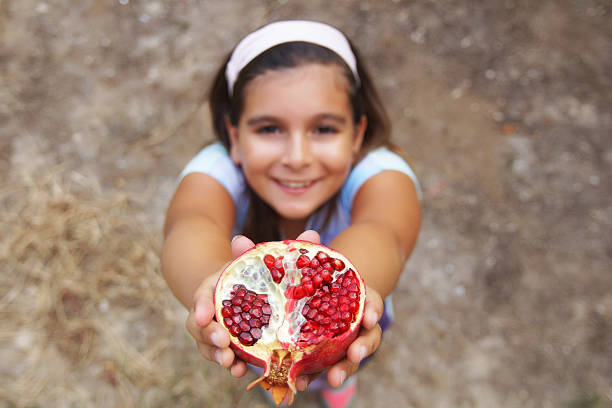 Girl with pomegranate