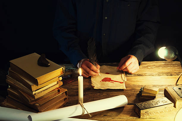 istock Man writing a letter with quill and sealing. Vintage 612493416
