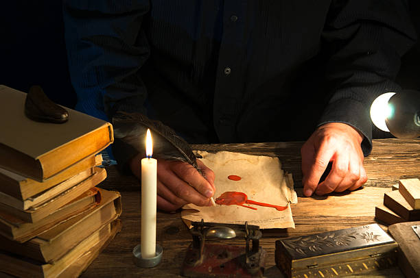 istock Man writing a letter with quill and sealing. Vintage 612493548
