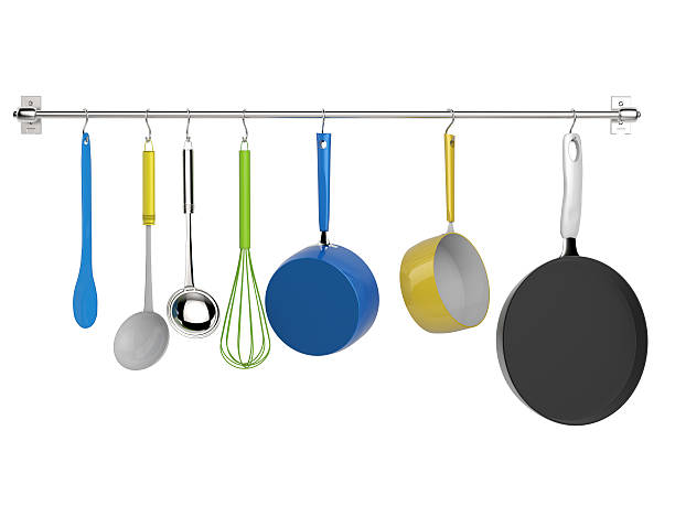 кухонная стойка висит с кухонной утварью - pan saucepan kitchen utensil isolated стоковые фото и изображения