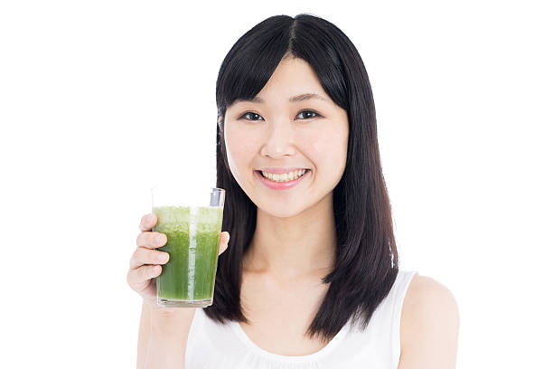 istock Woman drinking a smoothie 612496650
